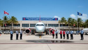 An Air Canada Montreal flight is parked on the tarmac in front of an airport terminal. Uniformed staff flank the plane, with a banner announcing the inaugural Montreal to Belize service. Canadian and Belizean flags are displayed proudly.