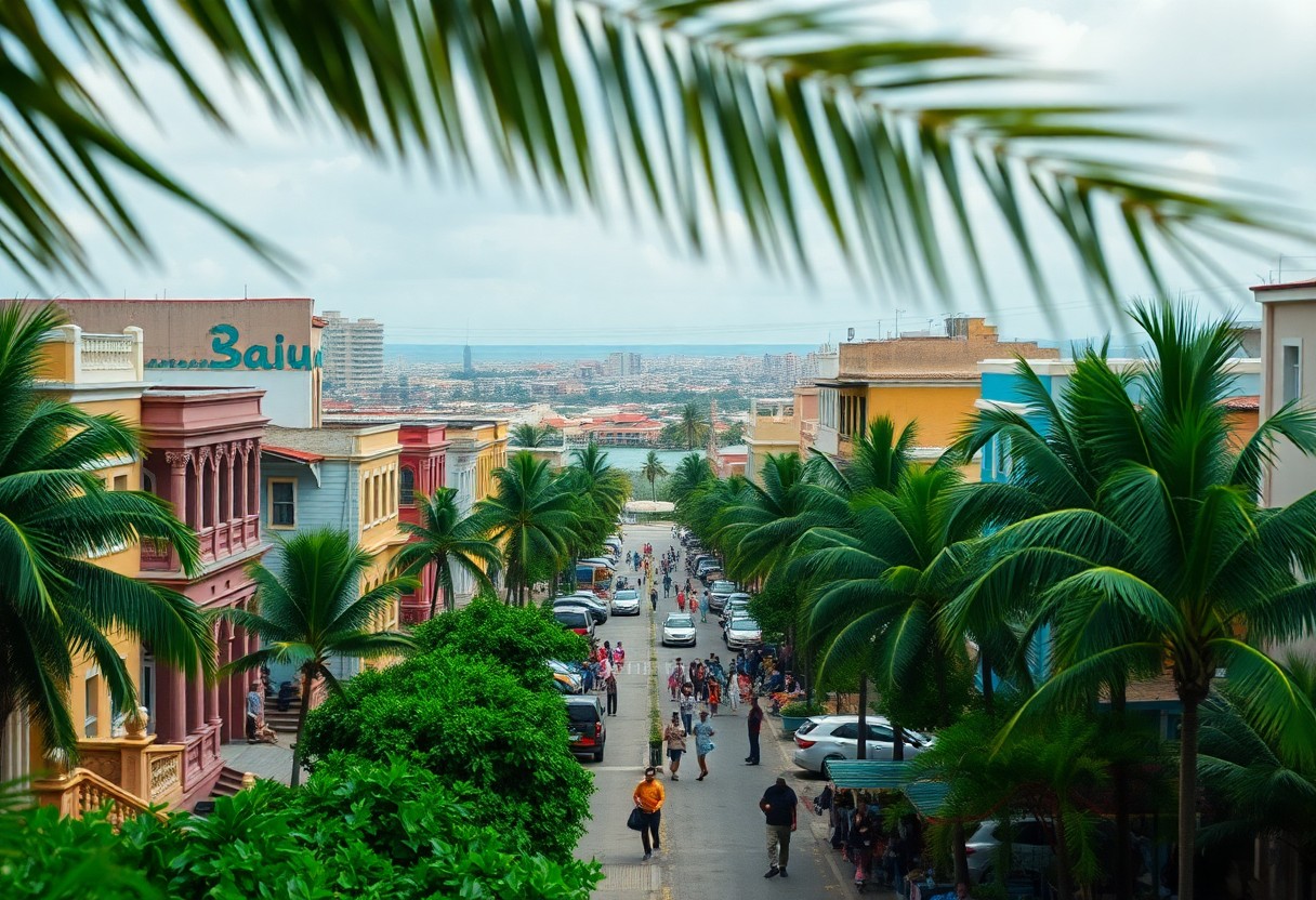 A vibrant street scene in a tropical city features colorful buildings and palm trees lining the road. People are walking along the street, and cars are parked on both sides. The sky is cloudy, and a distant view of the city is visible.