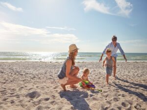 Family playing on the beach in Belize