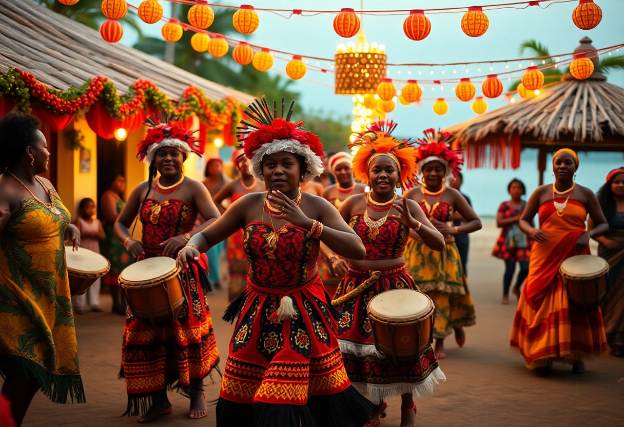 A group of women in colorful, traditional attire dance and play drums at an outdoor celebration. They are surrounded by festive string lights and decorated huts, with a backdrop of palm trees and a body of water.